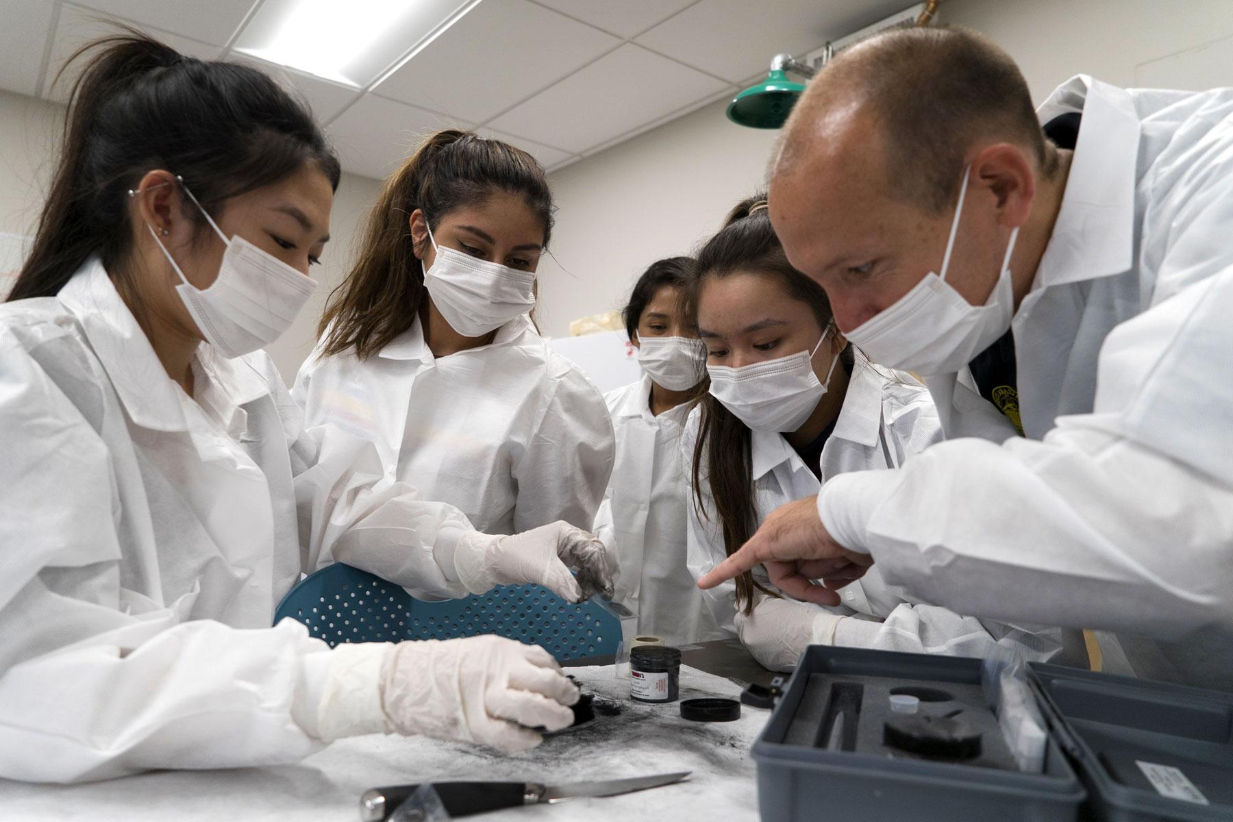 Forensic science students in lab image